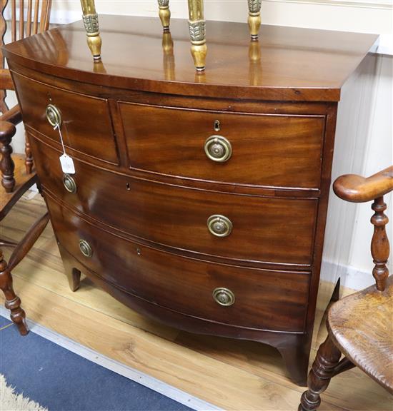 An early 19th century mahogany bowfront chest of two short and two long drawers W.89cm